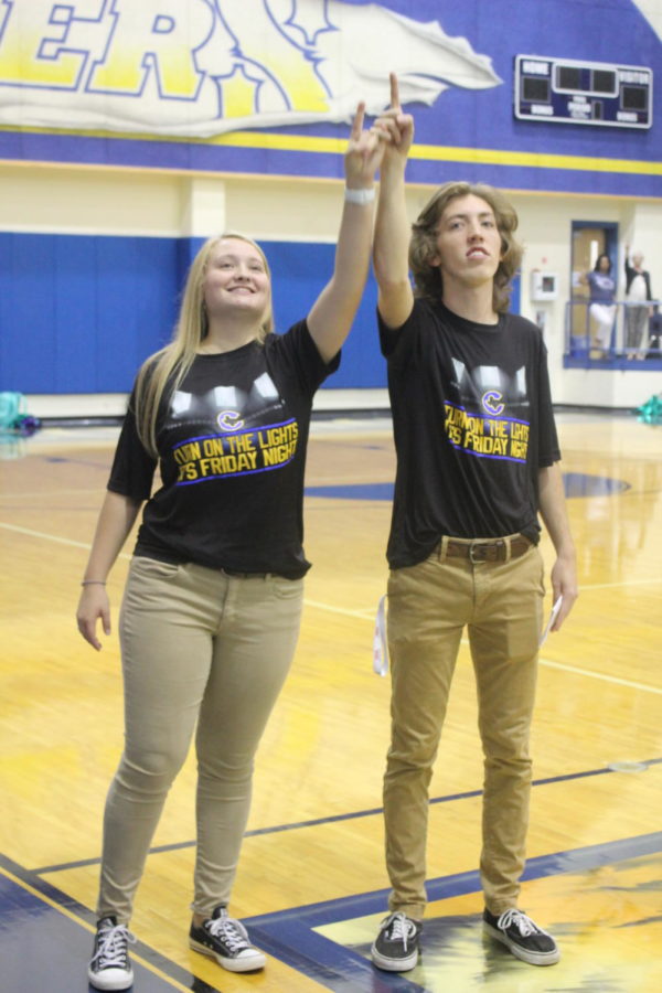 Corbin Hill and Allison Spence are side by side singing the Corsicana traditional school song together.