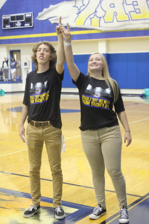 Corbin Hill and Allison Spence are side by side singing the Corsicana traditional school song together.