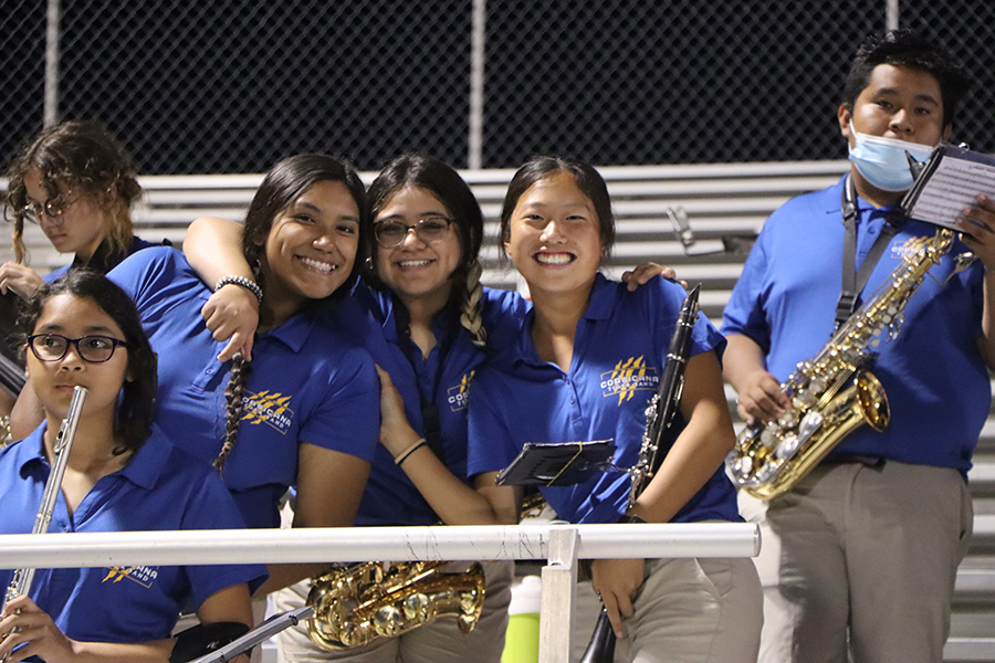 Woodwinds+group+hug+and+smile.